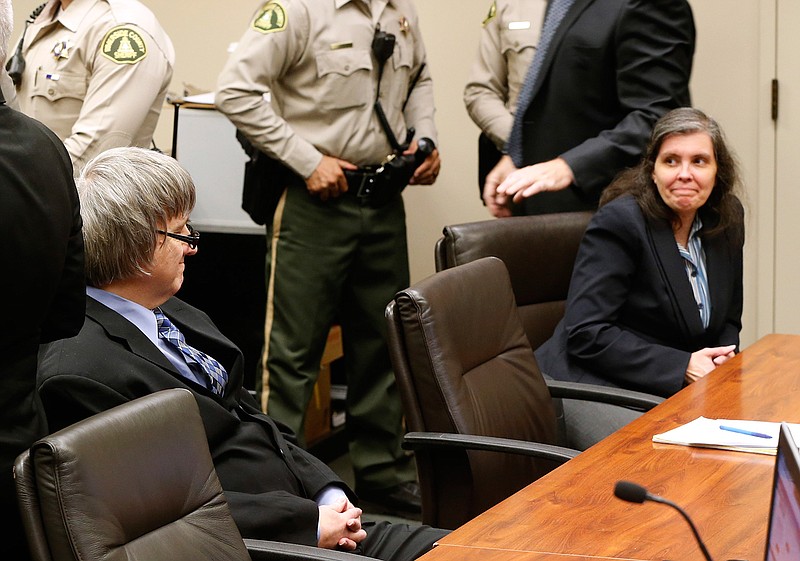 David and Louise Turpin look art each other as they appear in court for a conference about their case in Riverside, Calif., Friday, Feb. 23, 2018. They have pleaded not guilty to torture and other charges and each is held on $12 million bail. The couple was arrested last month after their 17-year-old daughter escaped from the family's home in Perris, Calif., and called 911. (AP Photo/Damian Dovarganes, Pool)