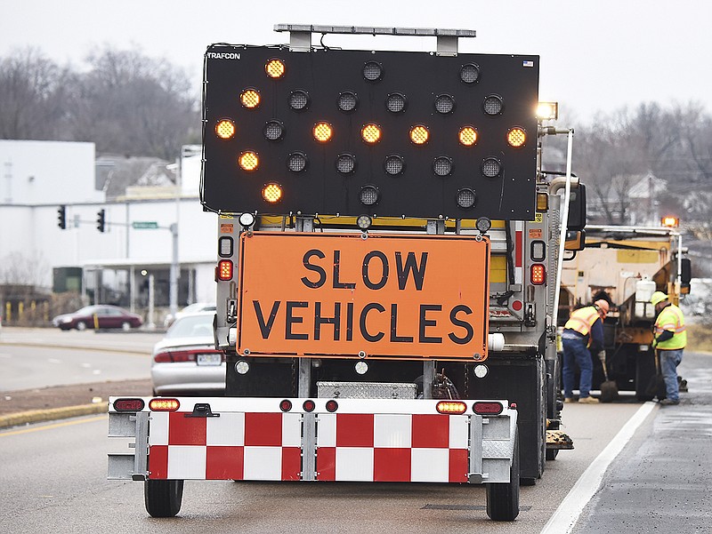In this Feb. 22, 2018 photo, MoDOT employees are eastbound on U.S. 50 in Jefferson City, stopping to fill potholes that, due to rain and freezing temperatures, cropped up in large numbers. (News Tribune photo)