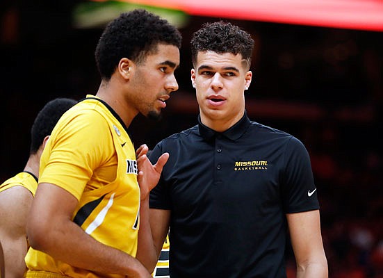 Michael Porter Jr. talks with his brother, Jontay, during a timeout in Missouri's game against Illinois in late December 2017 in St. Louis.