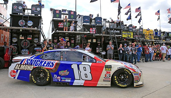 Kyle Busch pulls into the garage during practice Saturday for the Cup Series race at Atlanta Motor Speedway in Hampton, Ga. Busch will start first today.