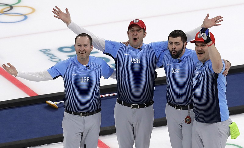 United States team celebrate during the men's curling finals match against Sweden at the 2018 Winter Olympics in Gangneung, South Korea, Saturday, Feb. 24, 2018. United States won gold. (AP Photo/Aaron Favila)