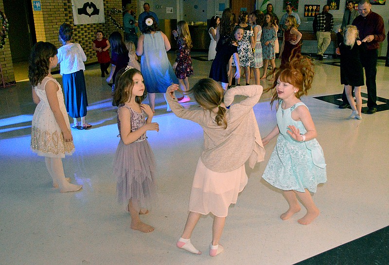 Young girls dance during the Eugene Father/Daughter Dance Saturday night. The dance was for PreK-6th grade girls and their dads in the high school cafeteria.