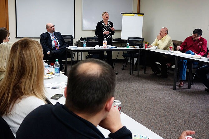 Speaking Friday at the Callaway Chamber's Lunch N Learn group were Ken Chapman, re-entry coordinator for the state Department of Corrections, sitting at left, and Anne Herman, standing, district DOC coordinator. They spoke about vocational training and educational programs at Missouri prisons and how newly released prisoners can be a convenient and trained work force.