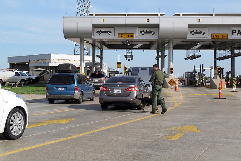 Vehicles wait for inspection Feb. 2 at the Border Patrol's Laredo North vehicle checkpoint in Laredo, Texas. When traffic backs up at Laredo North, agents say they sometimes have to speed up inspections to try to move vehicles through more quickly.
