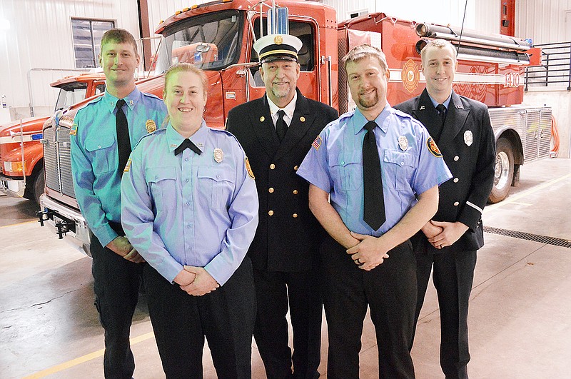 Gary Berendzen surrounded by his children, from left, Adam, Jennifer, Eric and Jesse. The family currently serve on the Cole County Fire Protection District. 