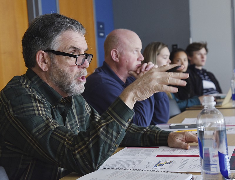 Julie Smith/News Tribune
Stu Murphy, JJ Gates and others listen to a presentation on the Parks Master Plan.