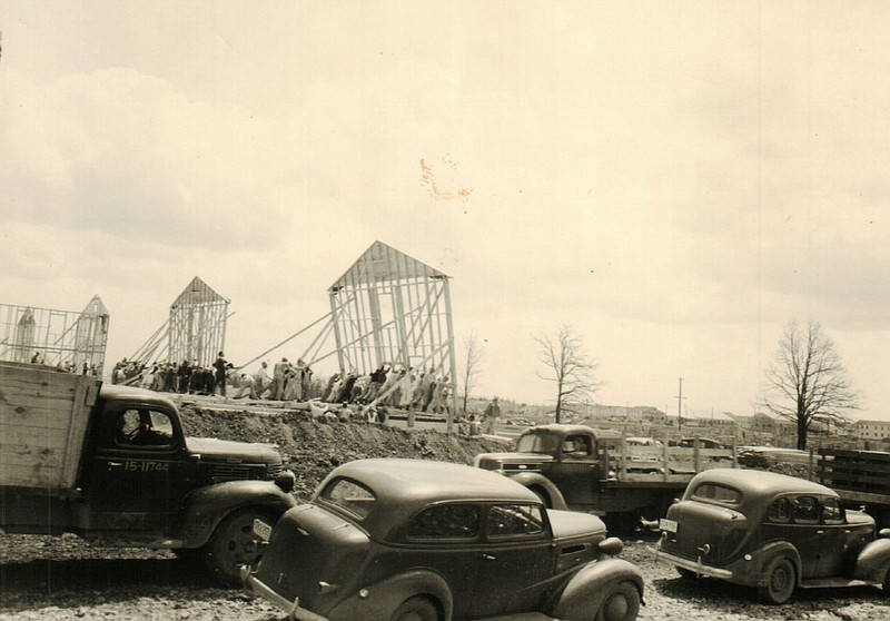 <p>Camp Crowder Archives</p><p>Construction crews raise the walls for barracks on Camp Crowder. The first troops began arriving Dec. 2, 1941, at the Neosho area post.</p>