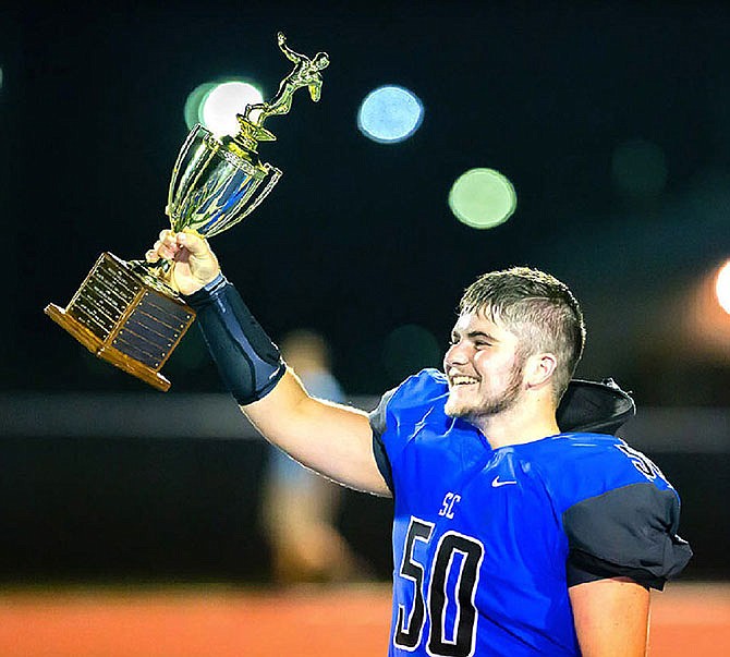 Braeden Sconce is shown celebrating with the Callaway Cup trophy in 2016 after the Bulldogs' 36-14 victory over the North Callaway Thunderbirds in Mokane. Sconce, 19, died Tuesday, Feb. 27, 2018 from injuries sustained in a Feb. 4 car crash.