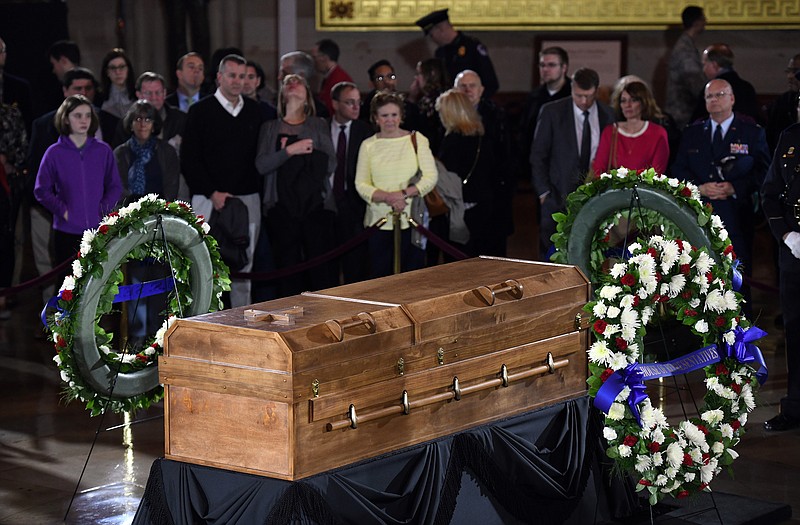 Well-wishers walk past the casket of the Rev. Billy Graham on Wednesday, February 28, 2018 as he lies in honor in the Rotunda of the U.S. Capitol in Washington, D.C. (Olivier Douliery/Abaca Press/TNS)