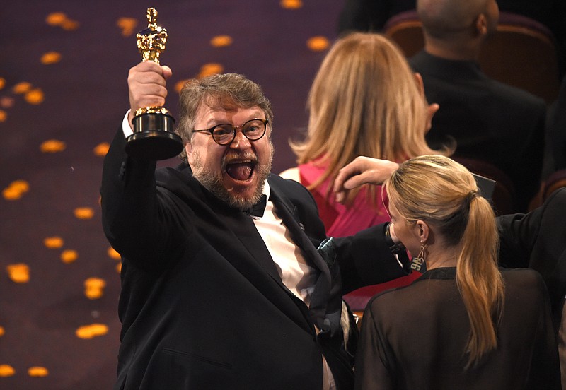 Guillermo del Toro, winner of the award for best director for "The Shape of Water" celebrates in the audience at the Oscars on Sunday, March 4, 2018, at the Dolby Theatre in Los Angeles. (Photo by Chris Pizzello/Invision/AP)