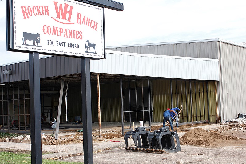 Workers prepare the old Rockin WH Ranch Companies building Feb. 28 to become Contemporary Concepts' new granite fabrication shop at 700 E. Broad St. The shop will offer services in shaping surfaces for countertops, showers and other household fixtures.