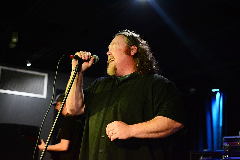 Collin Krabbe/News Tribune
Steve Walters sings an original song during the first round of the Bands Battle 4 the Badges music competition March 3 at The Bridge in Jefferson City. His band, Chemical Mass, was voted the best out of three contestants and will be playing during the final round of the contest, which takes place at the end of the month. 