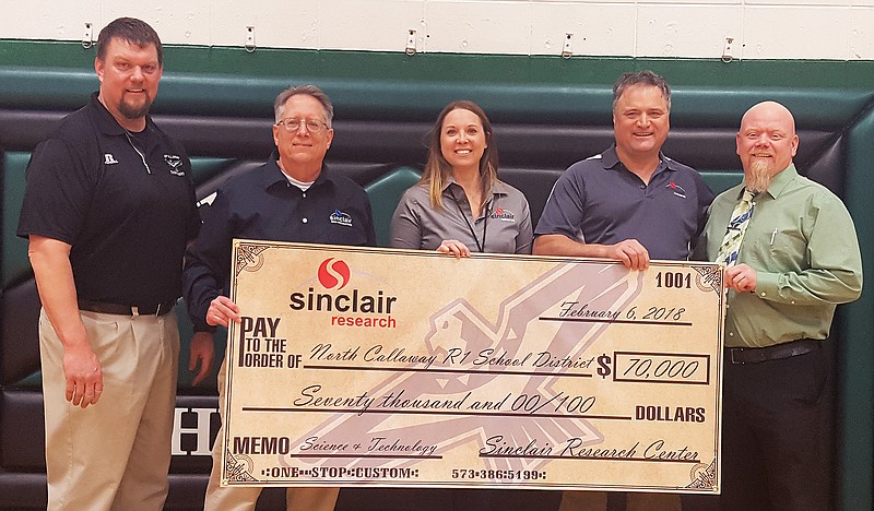 <p>Bryan Thomsen, superintendent of North Callaway R1 School District (left); Jeff White, Sinclair’s president of finance; Andrea Smithee, assistant to the president; Guy Bouchard, president/CEO of Sinclair Research Center; and Brian Jobe, principal at North Callaway High School, gather for the donation ceremony. (Submitted)</p>