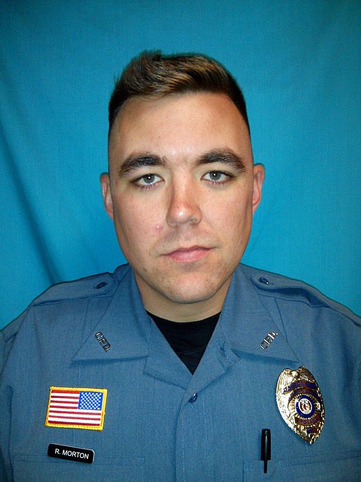 This undated photo released by Clinton Police Department shows officer Christopher Ryan Morton. Morton was fatally shot and two other officers injured while trying to apprehend the suspect after responding to a 911 call at a Missouri residence on Tuesday night, March 6, 2018. A SWAT team entered the home early Wednesday but found the suspect dead.