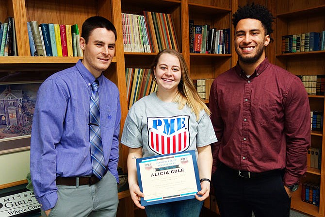 Alicia Cole, center, is the first graduate of Missouri Girls Town's Pathway to Military Enlistment program. She's joining the Air Force this month, thanks to help from Program Director Chad Vanderhoff, left, and his assistant, Jakeb Linear.