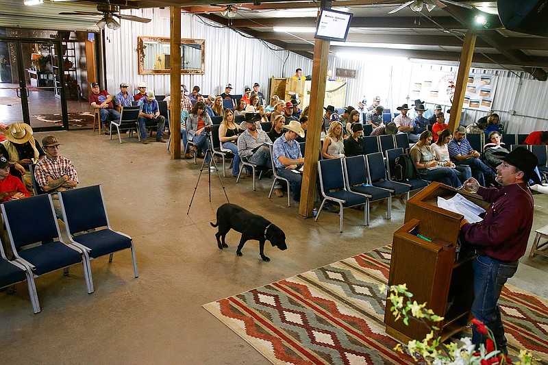 In this Sunday, Feb. 18, 2018 photo, Pastor Bubba Miller preaches to his congregation at the Branded for Christ Cowboy Church in Huntsville, Texas. (Michael Ciaglo/Houston Chronicle via AP)