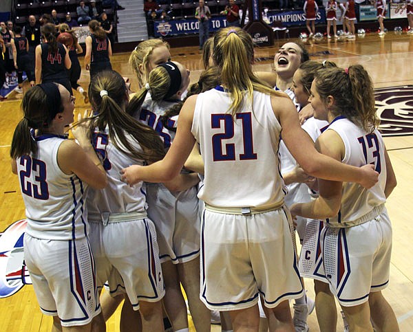 The California Lady Pintos celebrate following Friday afternoon's 60-39 win against Clark County in the semifinals of the Class 3 state basketball tournament in Springfield.
