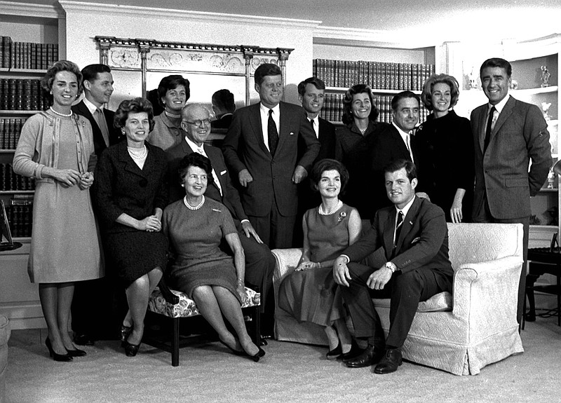 In this Nov. 9, 1960 file photo, President-elect John F. Kennedy, center, is surrounded by members of his family in the living room of the home of Joseph P. Kennedy, in Hyannisport, Mass. Standing, from left, Ethel Kennedy; Steve Smith and wife, Jean Kennedy; Senator Kennedy; brother Robert, campaign manager; sister, Patricia Lawford; Sargent Shriver; brother Ted's wife, Joan; and British actor Peter Lawford. In foreground, seated from are: Eunice Shriver, sister; mother Rose Kennedy; father, Joseph; Jacqueline Kennedy, wife of John; and Ted Kennedy, brother of the president-elect. CNN debuts a six-part series on the Kennedy family, part of its focus on historical programming for its original series (AP Photo, file)