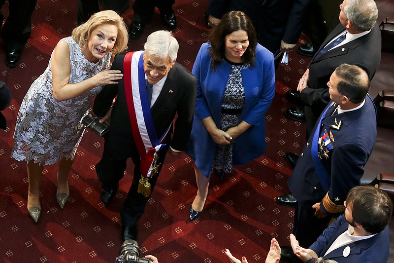 Chile's newly inaugurated President Sebastian Pinera and his wife Cecilia Morel, left, leave Congress after his swearing-in ceremony in Valparaiso, Chile, Sunday, March 11, 2018. Pinera returned to Chile’s presidency after his first term from 2010 to 2014. (AP Photo/Esteban Felix)
