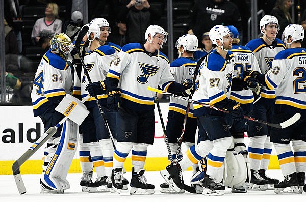 The Blues celebrate Saturday after defeating the Kings 7-2 in Los Angeles.