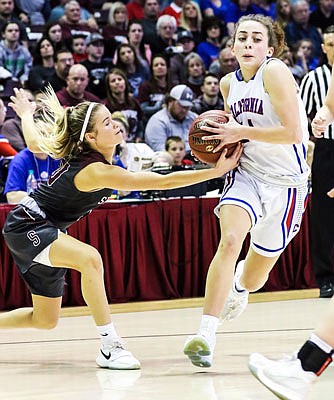 Elizabeth Lutz of California battles for control of the basketball during Saturday night's Class 3 state championship game against Strafford at JQH Arena in Springfield.