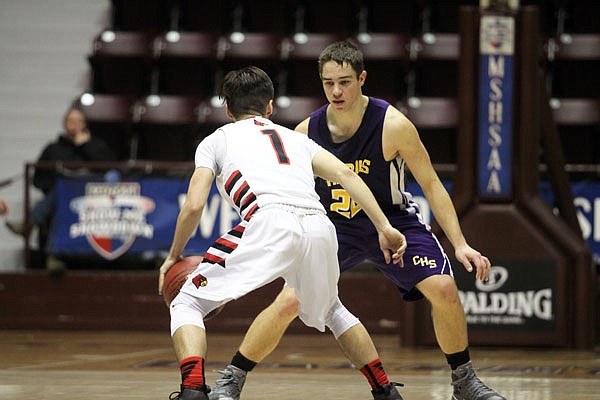Chamois junior Anthony Keilholz defends North Andrew senior Ryan Hughes during the second half of Saturday's Class 1 third-place game at Hammons Student Center in Springfield.