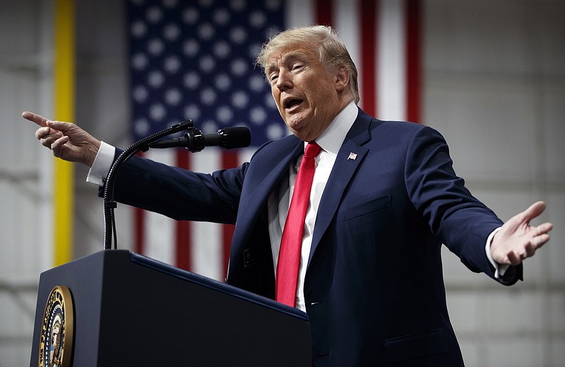 In this March 10, 2018, photo, President Donald Trump speaks at a campaign rally at Atlantic Aviation in Moon Township, Pa. Weeks after prodding lawmakers to stand up to the National Rifle Association,Trump is backing off his call for increasing the minimum age to buy an assault weapon — an idea strongly opposed by the NRA. (AP Photo/Carolyn Kaster)