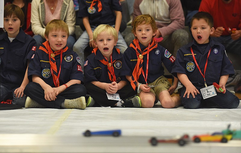 Tiger Scouts anxiously watch their cars compete in a race during the 2018 Five Rivers District Pinewood Derby at Blair Oaks Middle School on Saturday, March 10, 2018. 