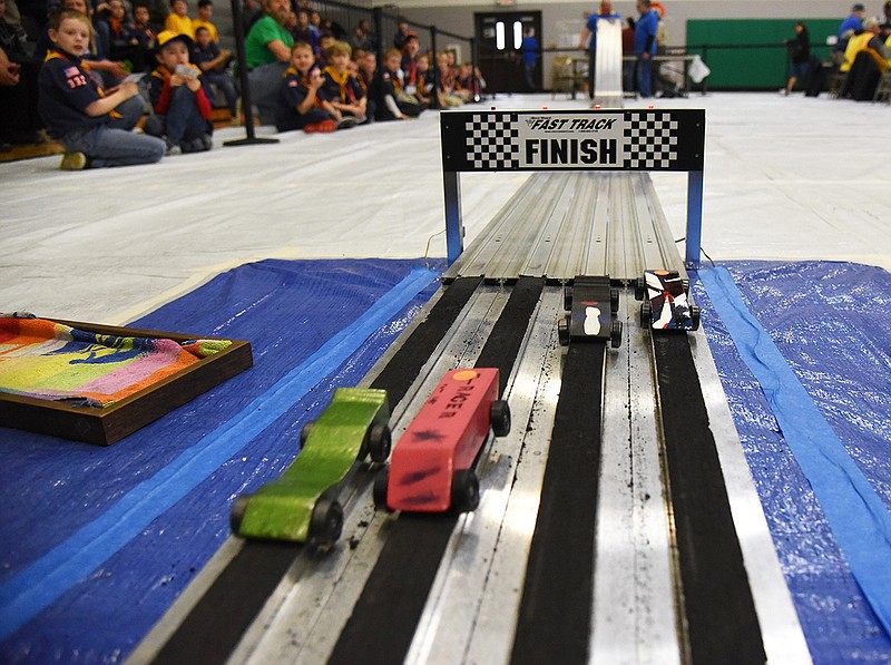 Cars pass the finish line during the 2018 Five Rivers District Pinewood Derby at Blair Oaks Middle School on Saturday, March 10, 2018. Hundreds of cars hit the track as Cub Scouts with different ranks competed.
