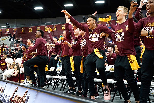 Loyola men's basketball players celebrate after the team was selected to play in the NCAA Tournament during Sunday's selection show watch party at Gentile Arena in Chicago.