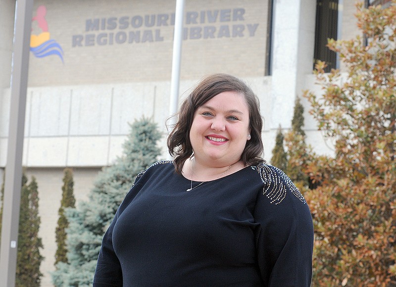 Natalie Newville, Marketing Manager for the Missouri River Regional Library, poses in front of the library.
