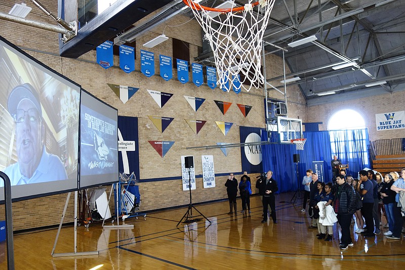 <p>Jenny Gray/FULTON SUN</p><p>Westminster College students and staff listen to an announcement from Kent C. Mueller via Skype. A 1962 Westminster graduate, Mueller announced he would donate $3 million to build a new outdoor sports complex starting this summer.</p>