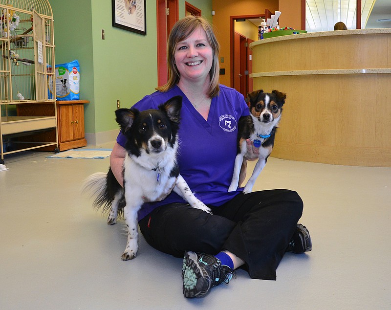 
Melissa Barry, a veterinarian assistant with the Jefferson City Animal Shelter animal control division, poses with Dizzy and Crum. She received the city's employee of the month award in February 2018. 