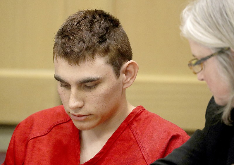 FILE - In this Feb. 19, 2018 file photo, Nikolas Cruz, accused of murdering 17 people in the Florida high school shooting, appears in court for a status hearing in Fort Lauderdale, Fla. Cruz was formally charged Wednesday, March 7, with 17 counts of first-degree murder, which could mean a death sentence if he is convicted. (Mike Stocker/South Florida Sun-Sentinel via AP, Pool, File)