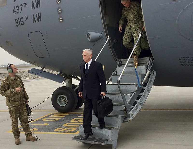 U.S. Defense Secretary Jim Mattis arrives in Kabul, Afghanistan on Tuesday, March 13, 2018.  Mattis said Tuesday he believes victory in Afghanistan is still possible — not necessarily on the battlefield but in facilitating a Taliban reconciliation with the Afghan government.  (AP Photo/Robert Burns)