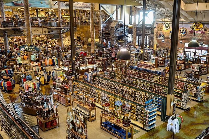 FILE- In this Sept. 19, 2017 photo, the sales floor is seen at a Bass Pro Shops store in Council Bluffs, Iowa. (AP Photo/Nati Harnik, File)