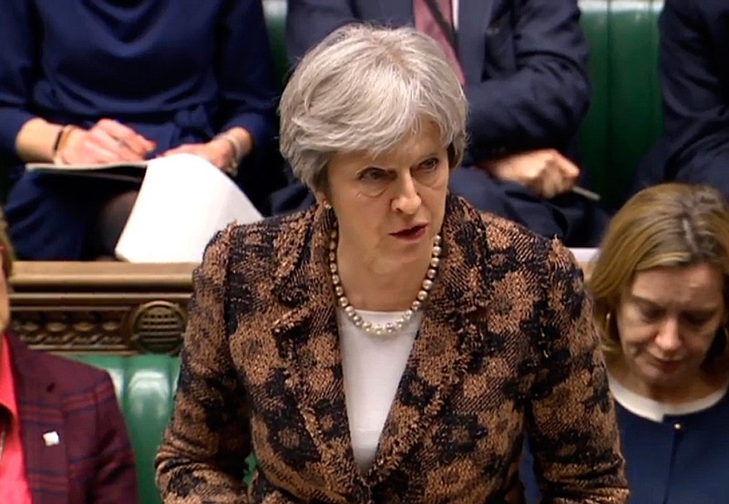 Britain's Prime Minister Theresa May speaks Monday in the House of Commons in London. May says her government has concluded it is "highly likely" Russia is responsible for the poisoning of an ex-spy and his daughter.