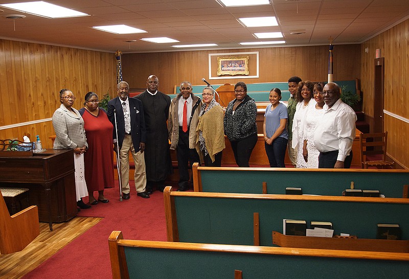 Members of the Watts Chapel CME Church are shown in their recently improved building. From left, they are Beatrice Hawkins, Janice Jordan, Gerald Green, Alton Hawkins, Leodis Buckley, Teresa Buckley, Jaykaria Jordan, Octavia Grant, Jordan Randle, Norma Jordan, Mary Lockett and Flem Lockett.
