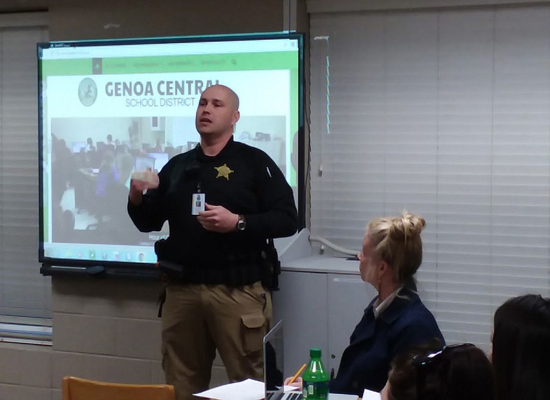  Darrell Klink, the school resource officer at Genoa Central School District, speaks to the district's board of directors Monday about how he has worked to increase school safety. Genoa Superintendent Angela Bryant is looking into several possibilities on how to do that, including deputizing teachers.