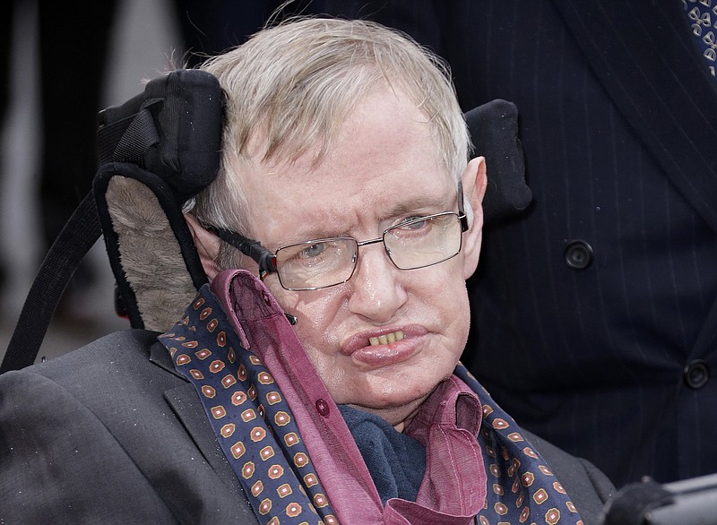 FILE - In this March 30, 2015 file photo, Professor Stephen Hawking arrives for the Interstellar Live show at the Royal Albert Hall in central London. Hawking, whose brilliant mind ranged across time and space though his body was paralyzed by disease, has died, a family spokesman said early Wednesday, March 14, 2018. (Photo by Joel Ryan/Invision/AP, File)