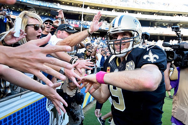 Saints quarterback Drew Brees reacts with fans after a 2016 game against the Chargers in San Diego.