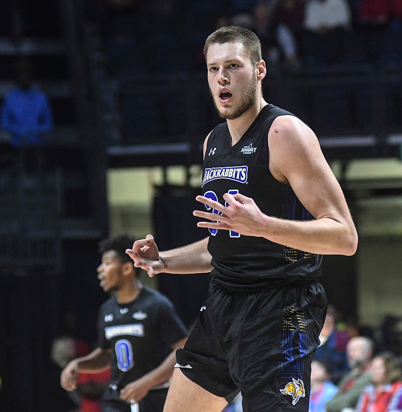 In this Nov. 28, 2017, file photo, South Dakota State's Mike Daum (24) reacts after making a three pointer against Mississippi in an NCAA college basketball game in Oxford, Miss. Daum, one of the nation's most prolific scorers, heads a list of several notable players from one-bid leagues relishing their chance at the spotlight this week. South Dakota State (28-6) is the No. 12 seed in the West Region and faces Ohio State (24-8) on Thursday in Boise, Idaho.(Bruce Newman/The Oxford Eagle via AP, File)