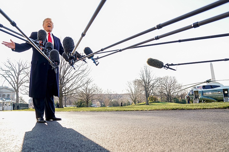 President Donald Trump speaks to reporters before boarding Marine One on the South Lawn of the White House in Washington, Tuesday, March 13, 2018, to travel to Andrews Air Force Base, Md. Trump is beginning a two day trip to California and St. Louis. (AP Photo/Andrew Harnik)