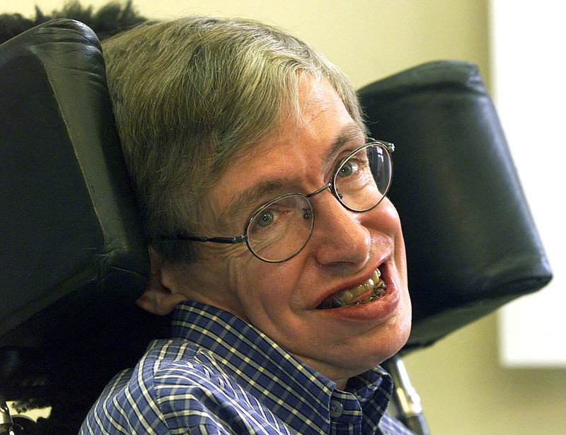 In this Wednesday, July 21, 1999, file photo, Professor Stephen Hawking smiles during a news conference at the University of Potsdam, near Berlin, Germany. Hawking has died, a family spokesman said early Wednesday, March 14, 2018.