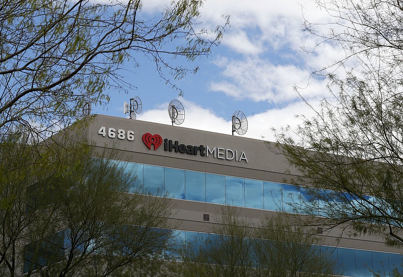 The iHeart Media headquarters is shown Thursday, March 15, 2018, in Phoenix. IHeartMedia, one of the world's largest radio companies, is seeking bankruptcy protection as part of an agreement with its lenders to reduce debt it took on to become a privately held company. The company formerly known as Clear Channel Communications said Thursday that it will operate its businesses as usual while it restructures its finances under Chapter 11 protection to reduce debt by more than $10 billion. (AP Photo/Matt York)