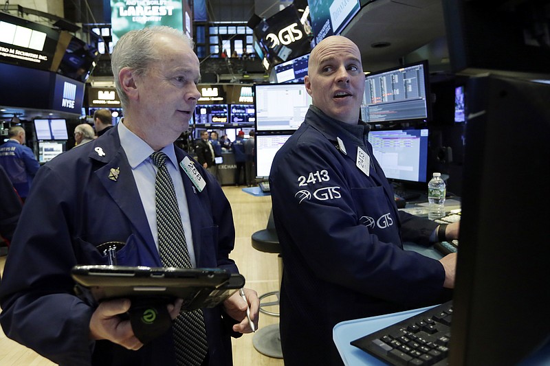 Trader James Riley, left, and specialist John O'Hara work on the floor of the New York Stock Exchange, Friday, March 16, 2018. Global stock markets were mixed Friday amid caution about U.S. plans to raise tariffs on imports of steel and aluminum and uncertainty over White House politics. (AP Photo/Richard Drew)
