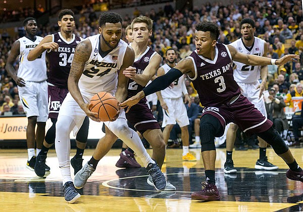 Missouri's Kevin Puryear pulls the ball away from Texas A&M's Admon Gilder during a game last month at Mizzou Arena. The Tigers will make their first NCAA Tournament appearance since the 2013 season tonight against Florida State.