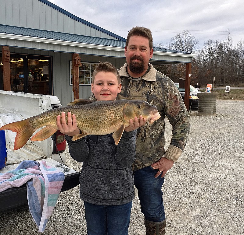 Eleven-year old Maverick Yoakum broke a state record by catching a 10-pound, 3-ounce river redhorse on Tavern Creek near St. Elizabeth on March 4, 2018. He is pictured with his dad, Bennett Yoakum.