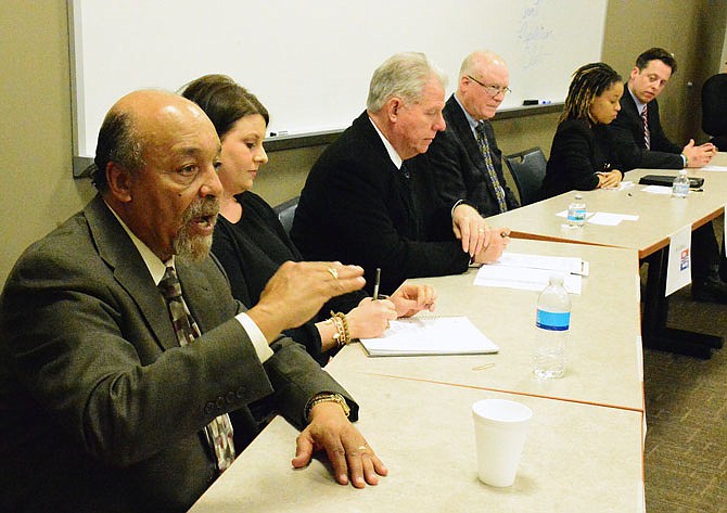 Jefferson City Public Schools Board of Education candidate Michael Couty, left, explains his platform Thursday alongside fellow candidates, from left, Lindsey Rowden and Ken Enloe and City Council candidates Jim Crabtree, Ashley Jones-Kaufman and Jon Hensley during the Cole County Republican Club's candidate forum at the Cole County Sheriff's Office.