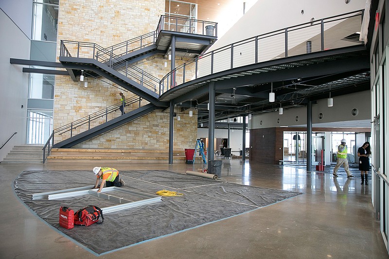 This March 1, 2018, photo shows the entryway at Manor Senior High School in Manor, west of Austin, Texas. There is no stopping the growth in Manor, one of the more affordable suburbs of Austin. But the school district is now putting its final touches on a new secondary school building that officials say will make room for more students without losing a close-knit feel. (Jay Janner/Austin American-Statesman via AP)